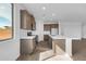 Modern kitchen with wood cabinets, white quartz countertops and stainless steel appliances at 35810 E 138Th Pl, Scottsdale, AZ 85262