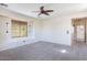 Bright bedroom with ceiling fan and window seat at 3731 E Fruitvale Ave, Gilbert, AZ 85297