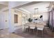 Bright dining room with a large table and modern light fixture at 3731 E Fruitvale Ave, Gilbert, AZ 85297