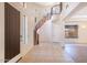 Grand entryway with a curved staircase and tile flooring at 3731 E Fruitvale Ave, Gilbert, AZ 85297