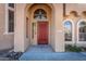 Elegant red front door with arched entryway at 3731 E Fruitvale Ave, Gilbert, AZ 85297