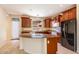 Kitchen features granite countertops and wood cabinets at 3731 E Fruitvale Ave, Gilbert, AZ 85297