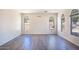 Living room with hardwood floors and arched windows at 3731 E Fruitvale Ave, Gilbert, AZ 85297