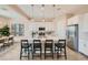 Modern kitchen with island and white cabinets at 3838 E Kenley Ln, San Tan Valley, AZ 85143