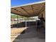 Covered horse stalls with metal fencing and dirt floor at 4038 W Morrow Dr, Glendale, AZ 85308