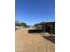 Sand arena with covered stalls for horses at 4038 W Morrow Dr, Glendale, AZ 85308