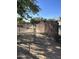 Chain link and wooden fence gate entrance to property at 4038 W Morrow Dr, Glendale, AZ 85308