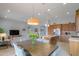 Open dining area with kitchen views and modern lighting at 4347 W White Horse Blvd, Eloy, AZ 85131