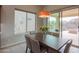 Bright dining area with wooden table and sliding glass doors at 4347 W White Horse Blvd, Eloy, AZ 85131