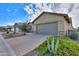 Light beige house with a gray garage and drought-tolerant landscaping at 4347 W White Horse Blvd, Eloy, AZ 85131