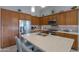 Modern kitchen with light wood cabinets and stainless steel appliances at 4347 W White Horse Blvd, Eloy, AZ 85131