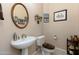 Powder room with pedestal sink and toilet at 4543 E Molly Ln, Cave Creek, AZ 85331