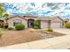 Single-story home with a landscaped front yard, two-car garage, and stone pathway at 4543 E Molly Ln, Cave Creek, AZ 85331