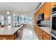 Kitchen with corner window, island, stainless steel appliances, and wood cabinets at 4543 E Molly Ln, Cave Creek, AZ 85331