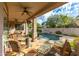 Relaxing covered patio with seating area overlooking the pool at 4543 E Molly Ln, Cave Creek, AZ 85331