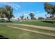 View of the lush green golf course and landscaping at 4902 E Flossmoor Ave, Mesa, AZ 85206