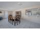 Dining room with tile floors and a view into the kitchen at 4902 E Flossmoor Ave, Mesa, AZ 85206