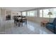 Bright dining room with tile floors and view of the golf course at 4902 E Flossmoor Ave, Mesa, AZ 85206