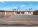 Single story home with a two car garage and landscaped front yard at 4902 E Flossmoor Ave, Mesa, AZ 85206