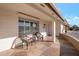 Relaxing front porch with wicker chairs and stone flooring at 4902 E Flossmoor Ave, Mesa, AZ 85206