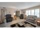 Cozy living room featuring comfortable seating and a large window at 4902 E Flossmoor Ave, Mesa, AZ 85206