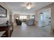 Open concept living room and kitchen with tile floors at 4902 E Flossmoor Ave, Mesa, AZ 85206