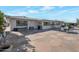 Large flagstone patio with seating area and built-in BBQ at 4902 E Flossmoor Ave, Mesa, AZ 85206