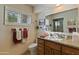 Bathroom with granite vanity and updated fixtures at 5160 N 45Th Pl, Phoenix, AZ 85018