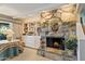 Stone fireplace with built-in shelving and a cozy seating area at 5160 N 45Th Pl, Phoenix, AZ 85018