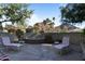 Outdoor patio with seating and a fountain featuring a mountain backdrop at 5160 N 45Th Pl, Phoenix, AZ 85018