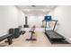 Well-equipped home gym with wood floor, large mirror, treadmill, bench, and free weights for a complete workout at 5314 E Calle Del Norte --, Phoenix, AZ 85018