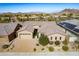 Aerial view of a house with a three-car garage and desert landscaping at 5626 E Sleepy Ranch Rd, Cave Creek, AZ 85331