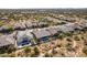 Aerial view of a residential neighborhood with desert landscaping and community pool at 5626 E Sleepy Ranch Rd, Cave Creek, AZ 85331