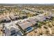 Aerial view showcasing a neighborhood with houses, desert landscape, and swimming pools at 5626 E Sleepy Ranch Rd, Cave Creek, AZ 85331