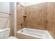 Clean bathroom with shower/tub combo and tiled walls at 5626 E Sleepy Ranch Rd, Cave Creek, AZ 85331