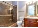 Bathroom with shower, toilet and wood vanity at 5626 E Sleepy Ranch Rd, Cave Creek, AZ 85331