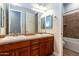 Bathroom with double sinks and wood cabinets at 5626 E Sleepy Ranch Rd, Cave Creek, AZ 85331