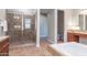 Elegant bathroom featuring a tiled shower, soaking tub, and a spacious vanity area at 5626 E Sleepy Ranch Rd, Cave Creek, AZ 85331