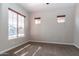 Bedroom showcasing natural light through the window and neutral carpet at 5626 E Sleepy Ranch Rd, Cave Creek, AZ 85331