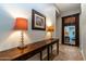 Elegant entryway with a console table, lamps, and an ornate mirror at 5626 E Sleepy Ranch Rd, Cave Creek, AZ 85331