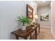 Hallway featuring a table with a lamp, artwork, and decorative plants at 5626 E Sleepy Ranch Rd, Cave Creek, AZ 85331