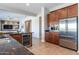 Kitchen area featuring stainless steel appliances, dark granite countertops, and a wine refrigerator at 5626 E Sleepy Ranch Rd, Cave Creek, AZ 85331