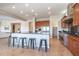 Well-lit kitchen featuring a spacious island, stainless steel appliances, and an adjacent walk-in pantry at 5626 E Sleepy Ranch Rd, Cave Creek, AZ 85331