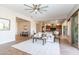 Bright living room featuring a ceiling fan and open layout with access to the kitchen at 5626 E Sleepy Ranch Rd, Cave Creek, AZ 85331