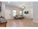 Living room area with a ceiling fan and a TV mounted on the wall at 5626 E Sleepy Ranch Rd, Cave Creek, AZ 85331