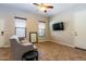 Spacious living room featuring tile floors and ceiling fan at 5626 E Sleepy Ranch Rd, Cave Creek, AZ 85331