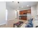 Living room area with a kitchenette, ceiling fan and a sofa at 5626 E Sleepy Ranch Rd, Cave Creek, AZ 85331