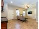 Bright living room with tile floors, sofa, and large TV at 5626 E Sleepy Ranch Rd, Cave Creek, AZ 85331