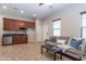 Living room area with a kitchenette, ceiling fan and a sofa at 5626 E Sleepy Ranch Rd, Cave Creek, AZ 85331