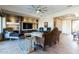 Living room with a stone fireplace and large TV at 5626 E Sleepy Ranch Rd, Cave Creek, AZ 85331